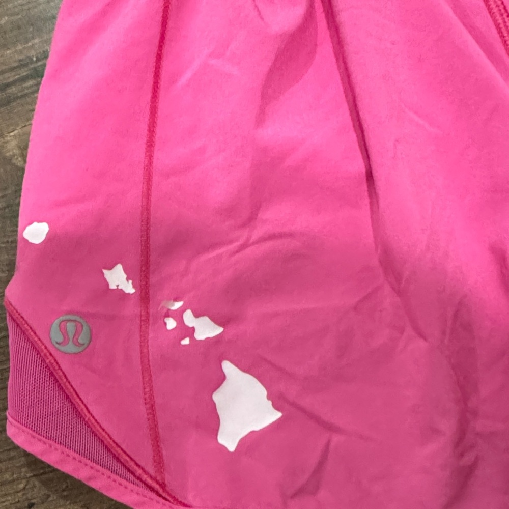 lululemon pink athletic top with white island-print details